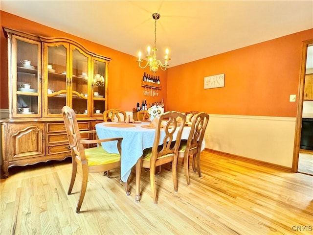 230 Thornton Cir S, Camillus, NY 13031 - dining space featuring light wood-type flooring and a chandelier