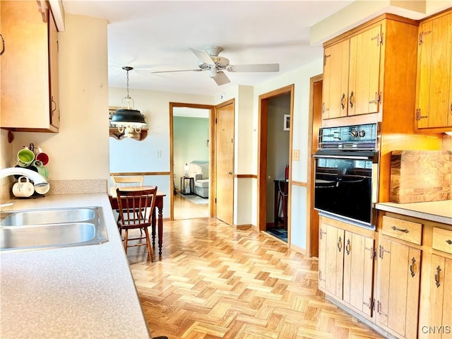 230 Thornton Cir S, Camillus, NY 13031 - kitchen with black oven, light countertops, a ceiling fan, and pendant lighting