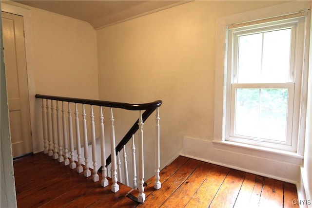 1500 Kimber Rd, Dewitt, NY 13078 - stairway with healthy amount of natural light and hardwood / wood-style flooring