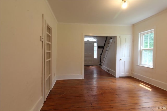 1500 Kimber Rd, Dewitt, NY 13078 - unfurnished room with crown molding, stairway, and wood-type flooring