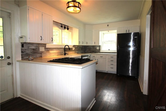 1500 Kimber Rd, Dewitt, NY 13078 - kitchen featuring black appliances, a peninsula, dark wood-style floors, and tasteful backsplash