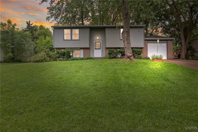 8273 Larkspur Dr, Clay, NY 13027 - bi-level home with brick siding, a front yard, and driveway
