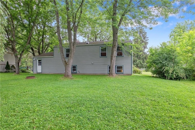 8273 Larkspur Dr, Clay, NY 13027 - rear view of property with a lawn