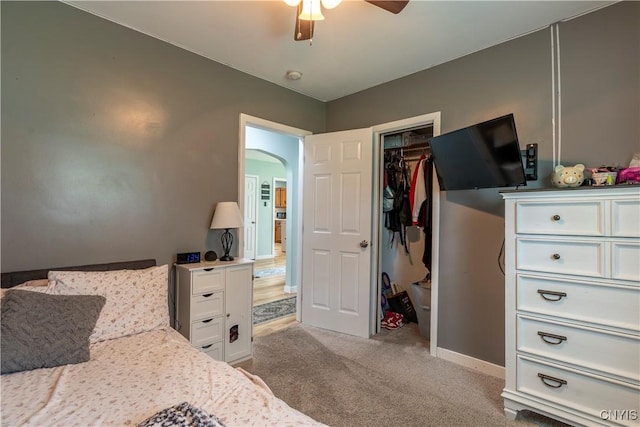 7 Bakeman St, Fulton, NY 13069 - bedroom featuring light colored carpet, arched walkways, a closet, and ceiling fan