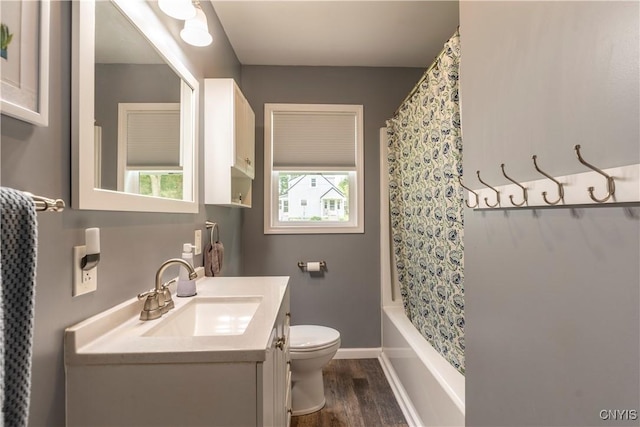 7 Bakeman St, Fulton, NY 13069 - bathroom featuring vanity, wood finished floors, and shower / tub combo with curtain