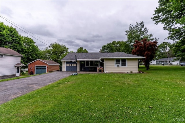 7 Bakeman St, Fulton, NY 13069 - view of front of property featuring a front yard and a garage