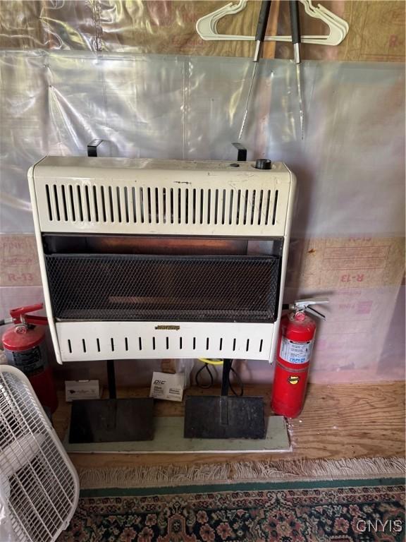 41856 County Route 41st Rd, Wilna, NY 13665 - detailed view of heating unit and a fire extinguisher