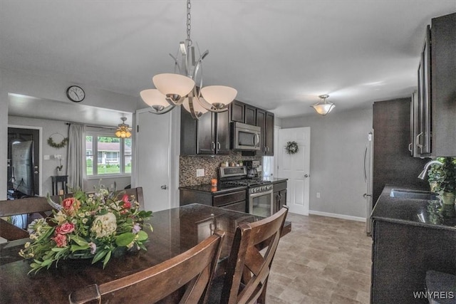 84 Kurtz Ave, Lancaster, NY 14086 - kitchen with stainless steel appliances, decorative backsplash, decorative light fixtures, and dark brown cabinetry