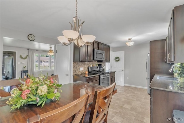84 Kurtz Ave, Lancaster, NY 14086 - kitchen with stainless steel appliances, backsplash, and dark brown cabinetry