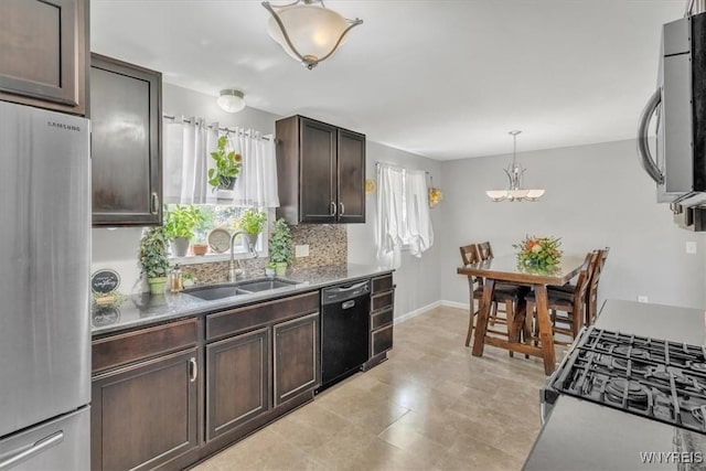 84 Kurtz Ave, Lancaster, NY 14086 - kitchen with appliances with stainless steel finishes, dark brown cabinets, a chandelier, hanging light fixtures, and backsplash