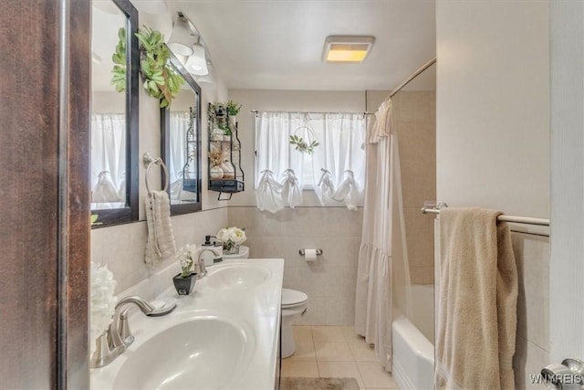 84 Kurtz Ave, Lancaster, NY 14086 - bathroom featuring shower / tub combo with curtain, double vanity, tile patterned floors, and tile walls