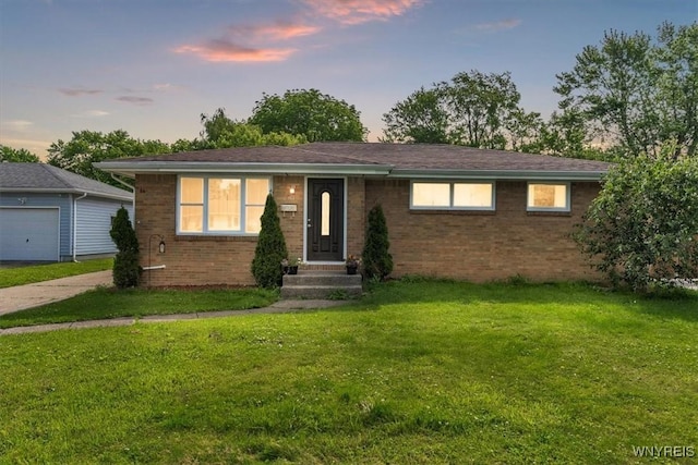 84 Kurtz Ave, Lancaster, NY 14086 - view of front of house featuring brick siding and a lawn