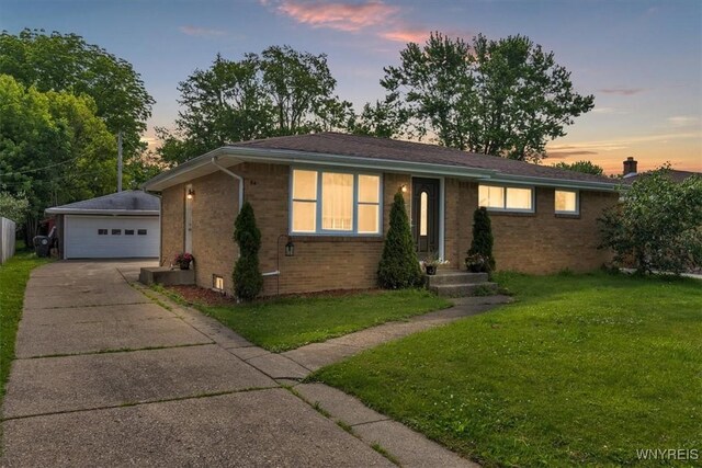 84 Kurtz Ave, Lancaster, NY 14086 - single story home with brick siding, an outdoor structure, a garage, and a yard
