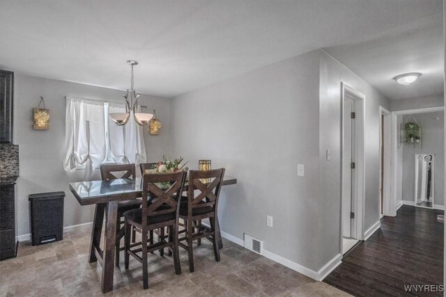 84 Kurtz Ave, Lancaster, NY 14086 - dining space with a chandelier and baseboards