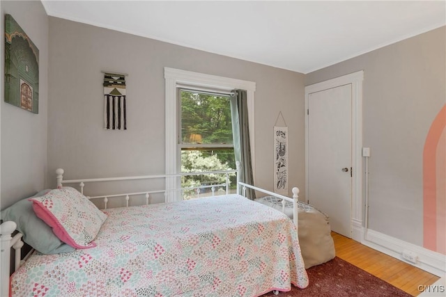 135 Strong Ave, Syracuse, NY 13210 - bedroom featuring wood finished floors and arched walkways