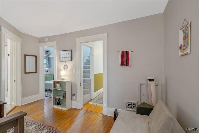 135 Strong Ave, Syracuse, NY 13210 - living area with light wood-style flooring and stairs