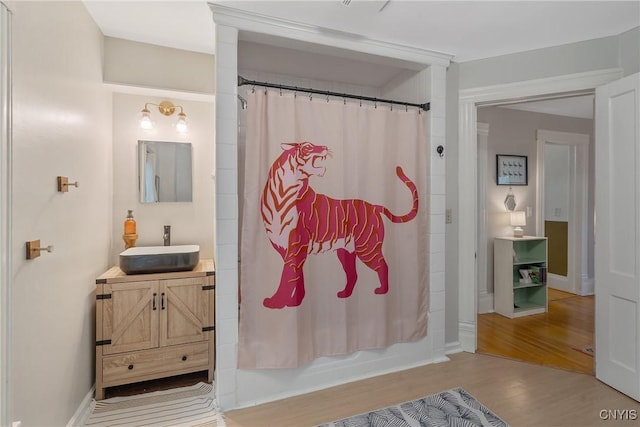 135 Strong Ave, Syracuse, NY 13210 - full bath featuring vanity, wood finished floors, and shower / tub combo with curtain