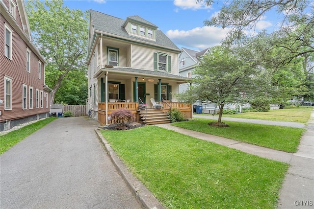 135 Strong Ave, Syracuse, NY 13210 - view of front of house featuring a porch, driveway, a front yard, and a shingled roof