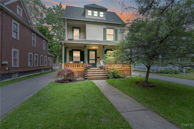 135 Strong Ave, Syracuse, NY 13210 - traditional style home with a porch, a yard, and a shingled roof