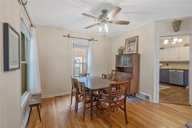 135 Strong Ave, Syracuse, NY 13210 - dining room with light wood-style floors, crown molding, and a ceiling fan