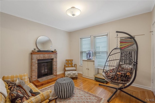 135 Strong Ave, Syracuse, NY 13210 - sitting room featuring crown molding, a brick fireplace, and wood finished floors