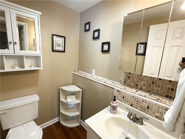 5968 E Lake Rd, Conesus, NY 14435 - half bath featuring wood finished floors, backsplash, and vanity