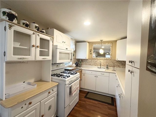 5968 E Lake Rd, Conesus, NY 14435 - kitchen with white appliances, dark wood-type flooring, decorative backsplash, white cabinets, and recessed lighting