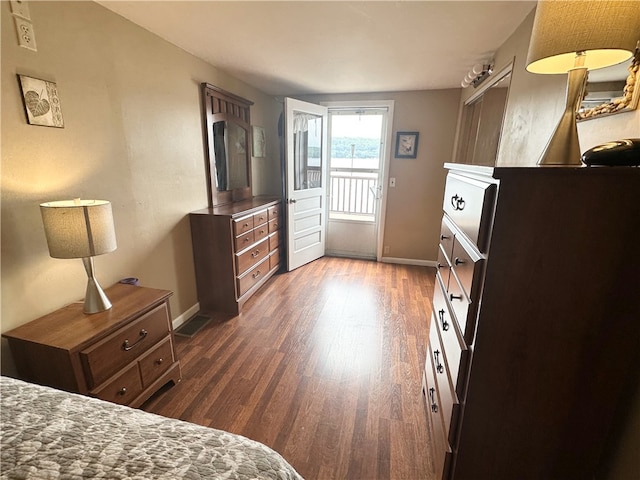 5968 E Lake Rd, Conesus, NY 14435 - bedroom with dark wood-style floors and access to exterior