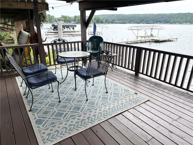 5968 E Lake Rd, Conesus, NY 14435 - wooden deck with a water view and a dock