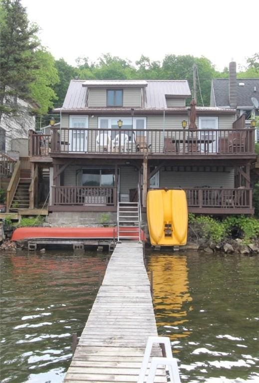 5968 E Lake Rd, Conesus, NY 14435 - rear view of house with stairway and a deck with water view