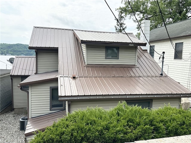 5968 E Lake Rd, Conesus, NY 14435 - view of home's exterior with a metal roof and a central AC unit