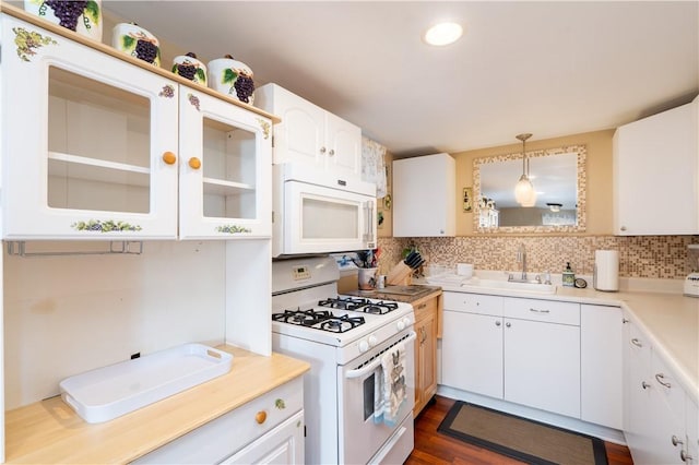 5968 E Lake Rd, Conesus, NY 14435 - kitchen with white appliances, tasteful backsplash, white cabinetry, light countertops, and recessed lighting