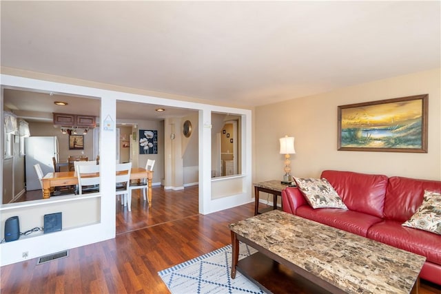 5968 E Lake Rd, Conesus, NY 14435 - living room featuring dark wood-style flooring and baseboards