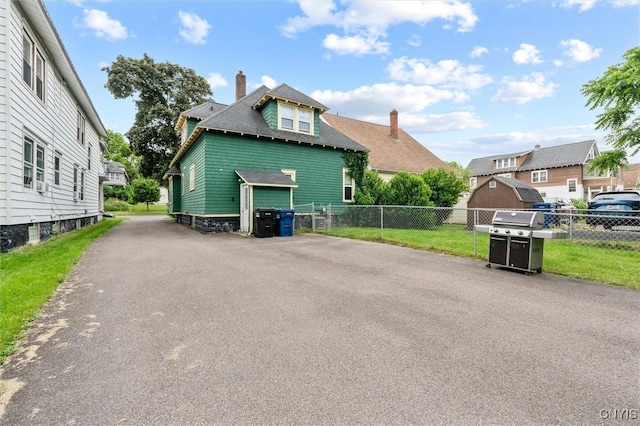 606 Tompkins St, Syracuse, NY 13204 - view of front of property featuring a chimney and a residential view