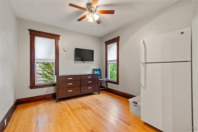 606 Tompkins St, Syracuse, NY 13204 - living area with light wood finished floors and a ceiling fan