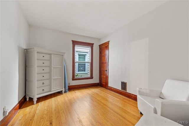 606 Tompkins St, Syracuse, NY 13204 - living area featuring light wood finished floors and baseboards