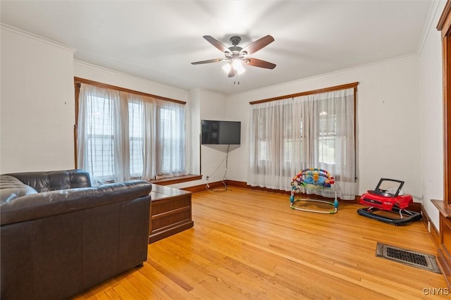 606 Tompkins St, Syracuse, NY 13204 - living area featuring a ceiling fan, light wood-style flooring, and crown molding