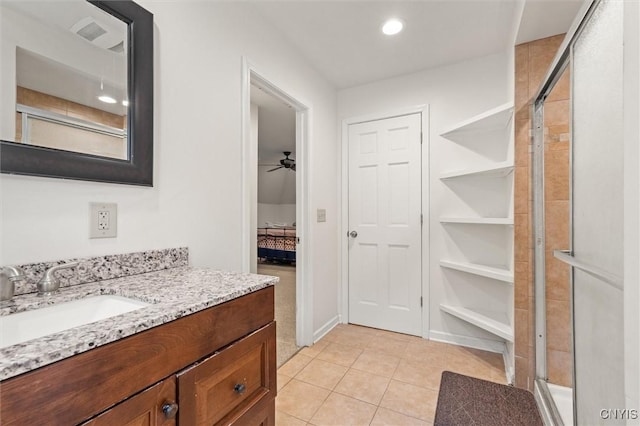 606 Tompkins St, Syracuse, NY 13204 - full bathroom with vanity, a stall shower, tile patterned floors, ceiling fan, and recessed lighting