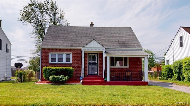 115 Southgate Rd, Cheektowaga, NY 14215 - view of front facade with brick siding and a front lawn