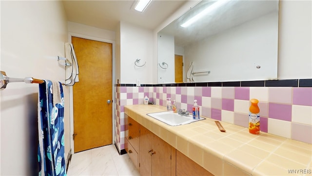 115 Southgate Rd, Cheektowaga, NY 14215 - full bath with vanity, marble look tile flooring, and backsplash