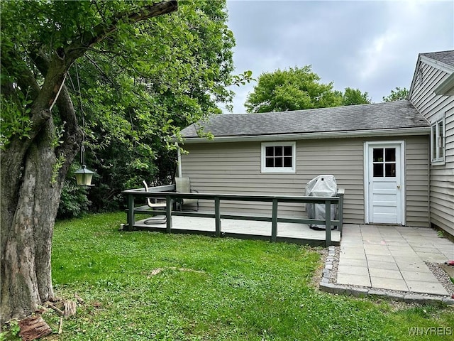 40 June Dr, Elma, NY 14059 - rear view of property with a yard, a shingled roof, and a wooden deck