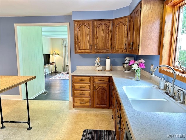 40 June Dr, Elma, NY 14059 - kitchen featuring light countertops, brown cabinetry, and plenty of natural light