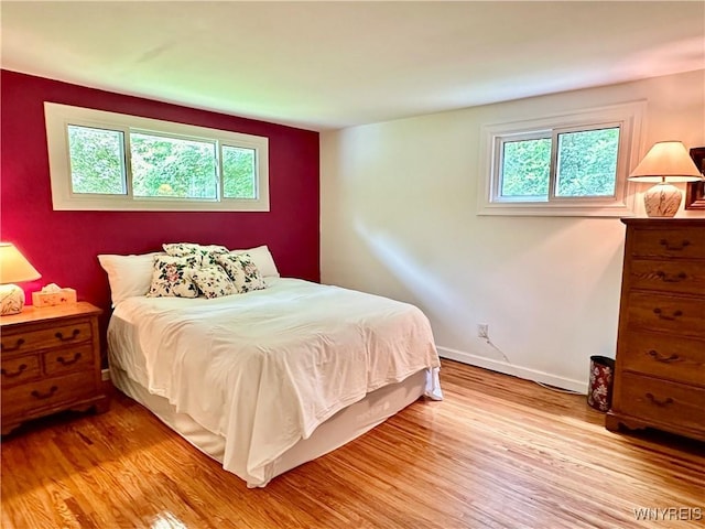 40 June Dr, Elma, NY 14059 - bedroom with light wood-style flooring and multiple windows