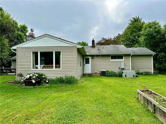 40 June Dr, Elma, NY 14059 - back of property with a chimney and a lawn