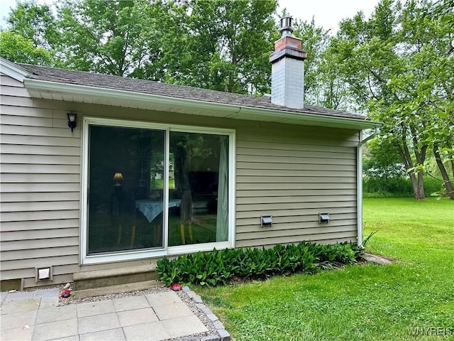 40 June Dr, Elma, NY 14059 - view of home's exterior with a lawn, a chimney, and roof with shingles
