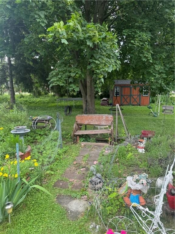 204 Owego St, Montour, NY 14865 - view of green lawn featuring a shed