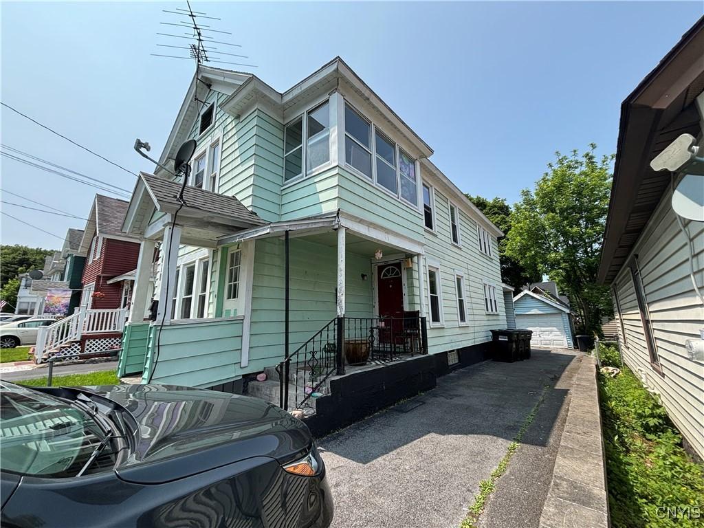 410 Chemung St, Syracuse, NY 13204 - view of front facade with a garage and an outdoor structure