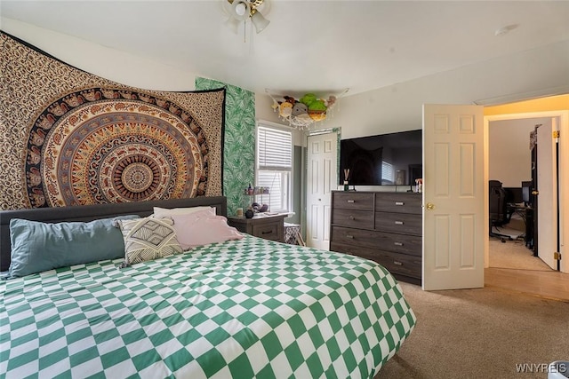 180 Lovering Ave, Buffalo, NY 14216 - bedroom with light colored carpet, a closet, and a desk
