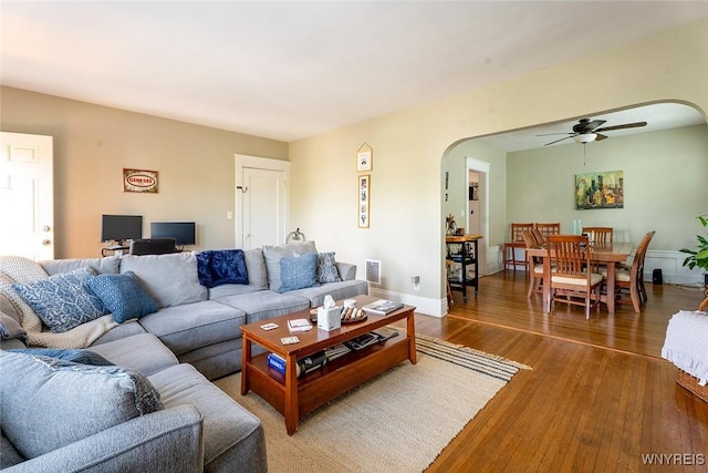 180 Lovering Ave, Buffalo, NY 14216 - living room featuring arched walkways, wood-type flooring, and a ceiling fan