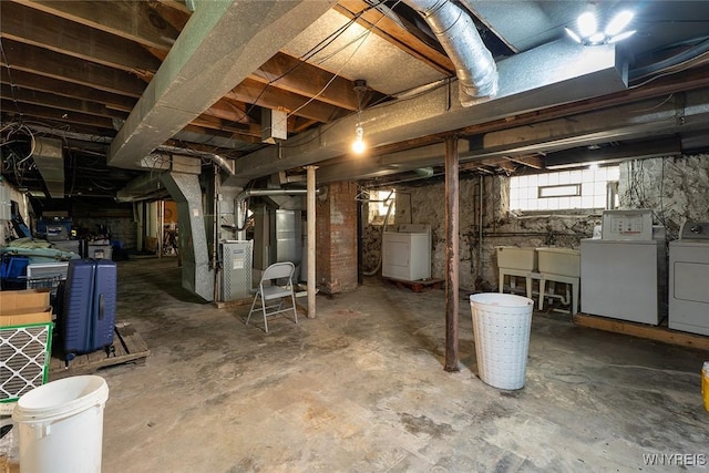 180 Lovering Ave, Buffalo, NY 14216 - below grade area featuring washer and clothes dryer and heating unit